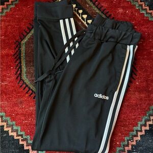 Adidas Women’s Black Joggers with White Stripes